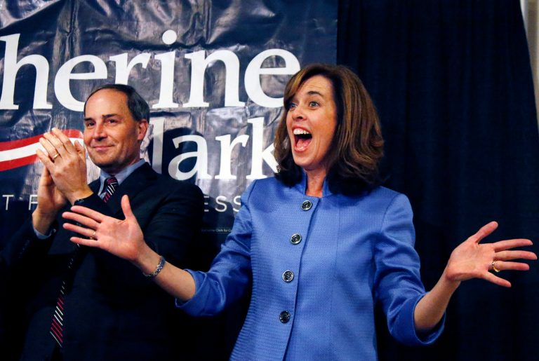 Democrat Katherine Clark reacts to supporters as her husband, Rod, applauds at her election night party in Stoneham, Mass., on Dec. 10, where she claimed victory in a special election for the vacated seat in Massachusetts' 5th Congressional District. The seat was left vacant by Edward Markey, who resigned after winning a special election to fill John Kerry's Senate seat after he stepped down to become secretary of state. Clark defeated Republican Frank Addivinola, a Boston attorney. (AP Photo/Elise Amendola)