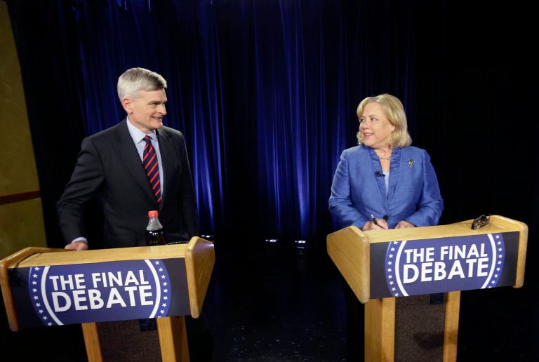 Sen. Mary Landrieu, D-La., right, and Rep. Bill Cassidy, R-La., greet each other before the start of their final debate for the Senate election runoff in Baton Rouge, La., Monday, Dec. 1, 2014. (AP Photo/Gerald Herbert)