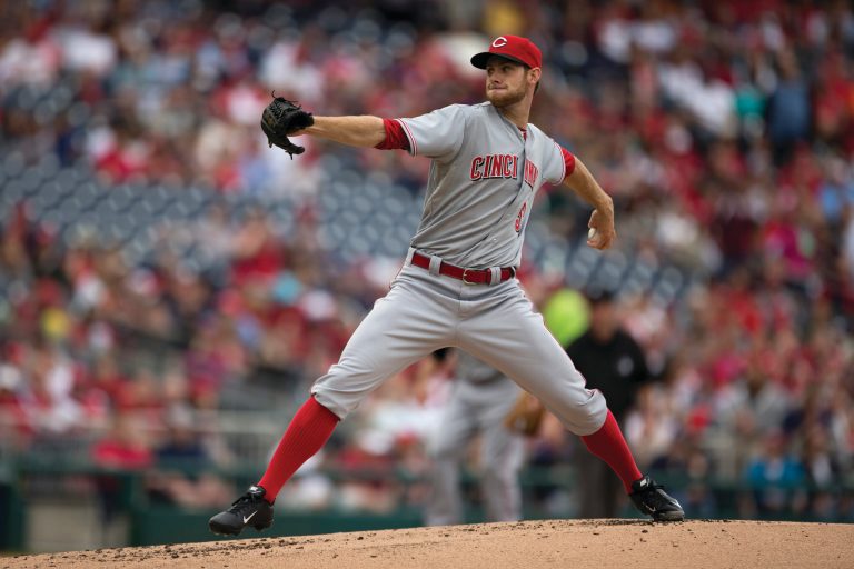 Evan Vucci/AP
Reds left-hander Tony Cingrani struck out 11 batters, including four in one inning to tie a major league record, in a victory over the Nationals on Sunday.