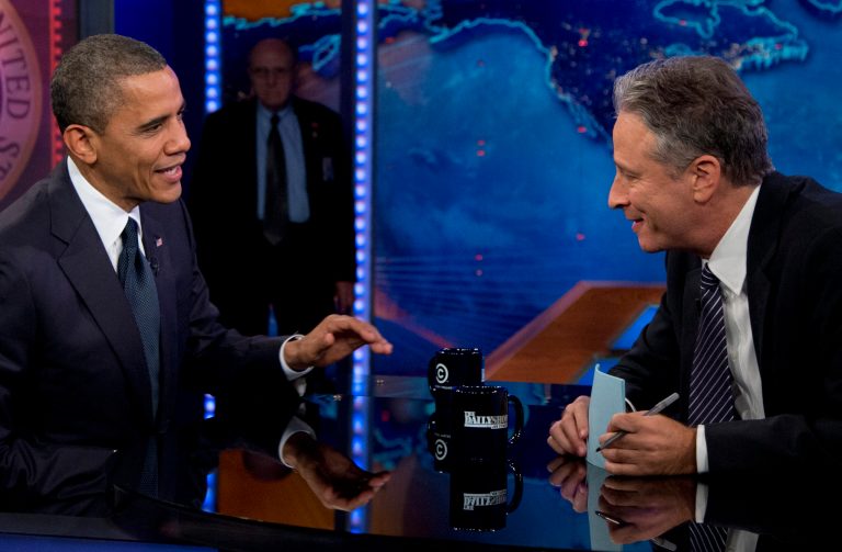 In this Oct. 18, 2012 file photo, President Barack Obama talks with Jon Stewart during a taping of his appearance on 