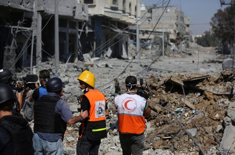 Members of Nongovernmental organizations and the media inspect the damage during a two-hour temporary cease-fire in Gaza City's Shijaiyah neighborhood, Wednesday, July 23, 2014. (AP Photo/Hatem Moussa)