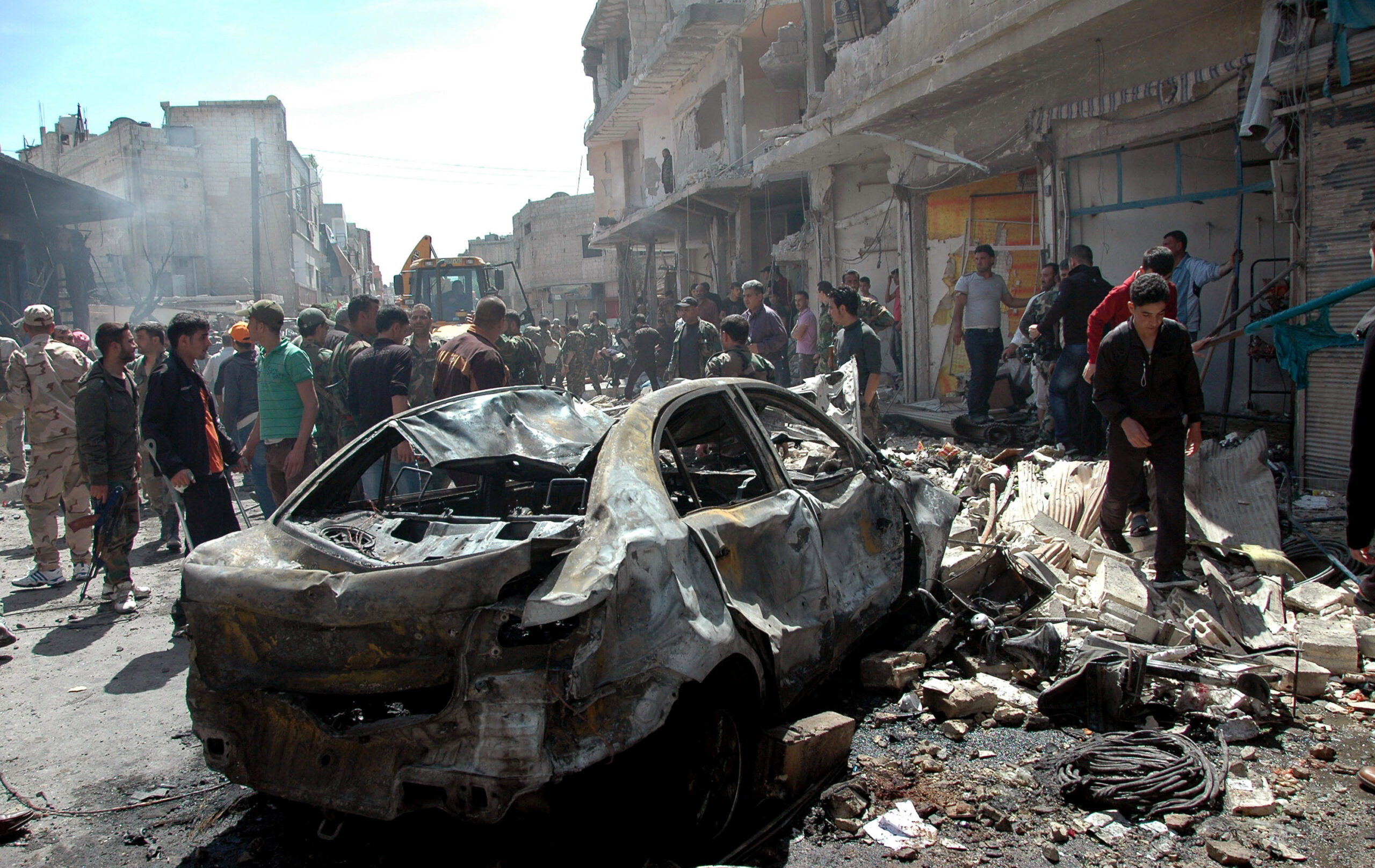 Attacks in 2 Syrian cities kill at least 54