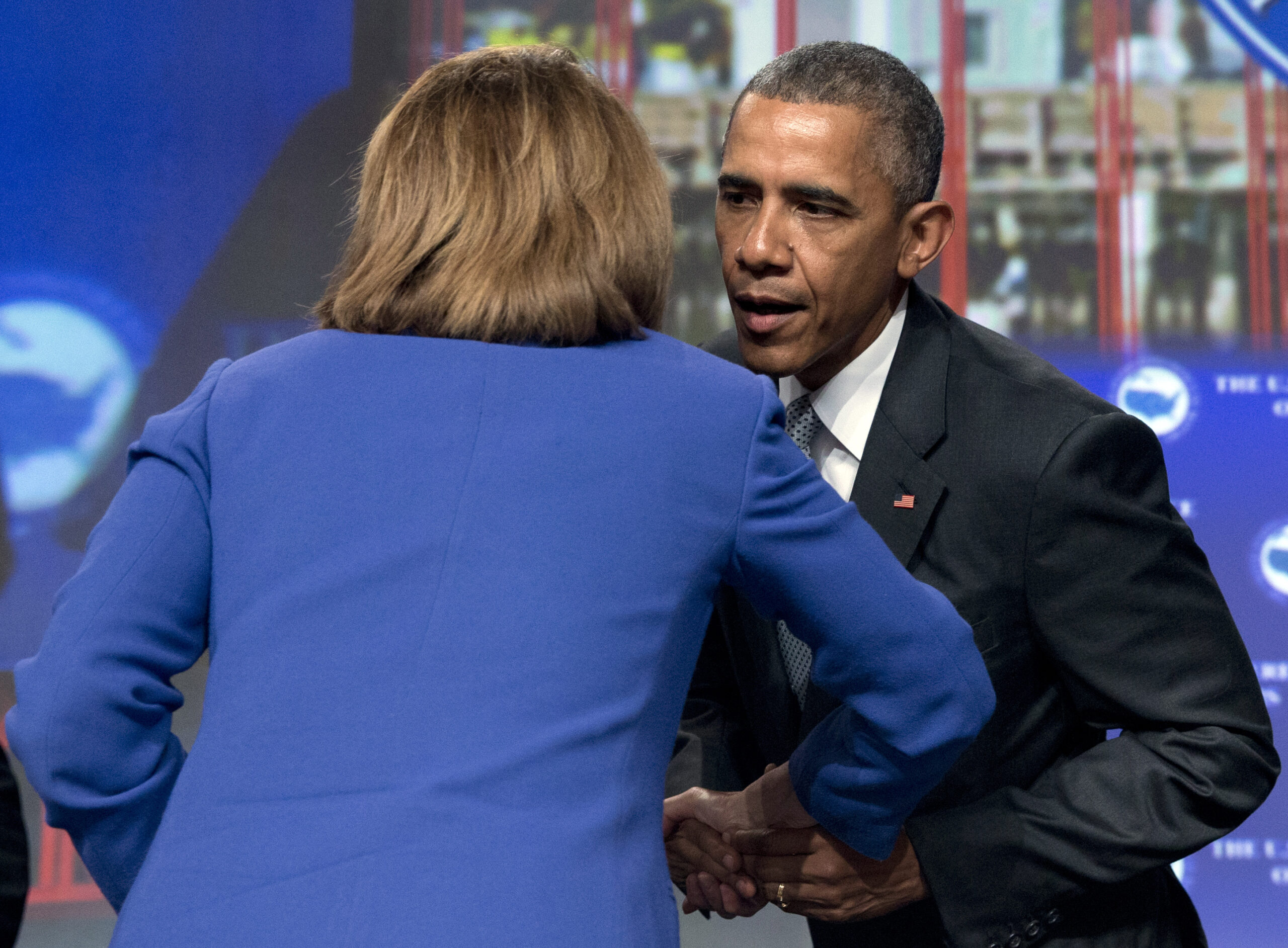 Pelosi, Obama cold front thaws at climate change fundraiser