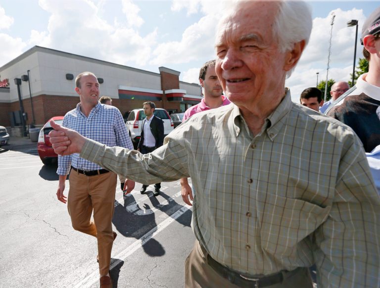 U.S. Sen. Thad Cochran, R-Miss., gives a thumbs up to supporters as he leaves a stop on the first day of a three-week campaign, Wednesday, June 4, 2014. Cochran, 76 and seeking a seventh term, faces state Sen. Chris McDaniel of Ellisville. (AP Photo/Rogelio V. Solis)