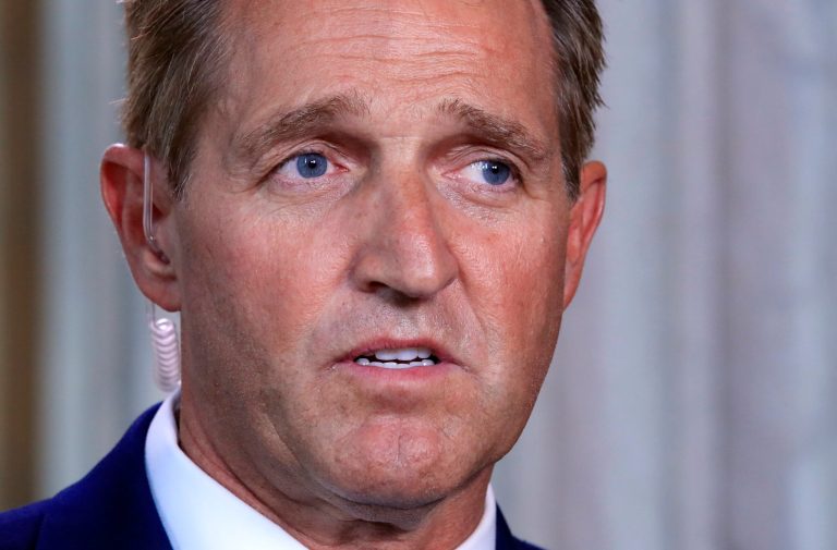 Sen. Jeff Flake, R-Ariz., speaks during a television interview Capitol Hill in Washington, Tuesday, Oct. 24, 2017. Sen. Flake, an Arizona Republican, announced he would not run for re-election in 2018, condemning in a speech aimed at President Donald Trump the 
