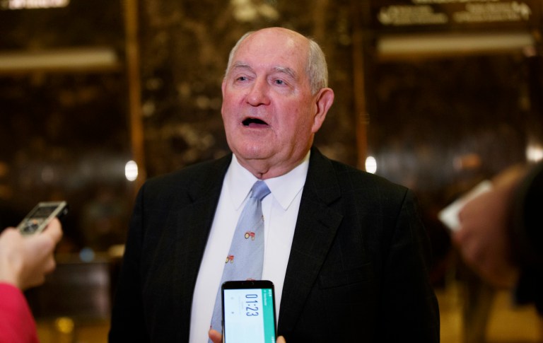 Like many ag-centric GOP politicians, Perdue has a record marked with corporate welfare. (AP Photo/Evan Vucci)