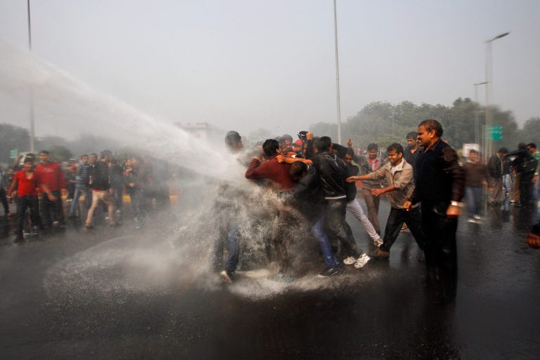   Indian police use water cannon to disperse protesters demonstrating against a gang rape and brutal beating of a 23-year-old student on a bus in New Delhi, India, Sunday, Dec. 23, 2012. The attack last Sunday has sparked days of protests across the country. (AP Photo/Tsering Topgyal)  