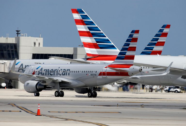An American Airlines jet taxis to the gate at Miami International Airport in May 2015. The largest U.S. carrier posted higher earnings than analysts expected at the end of 2017 after a $7 million benefit from the GOP-led tax overhaul. (AP Photo/Lynne Sladky)