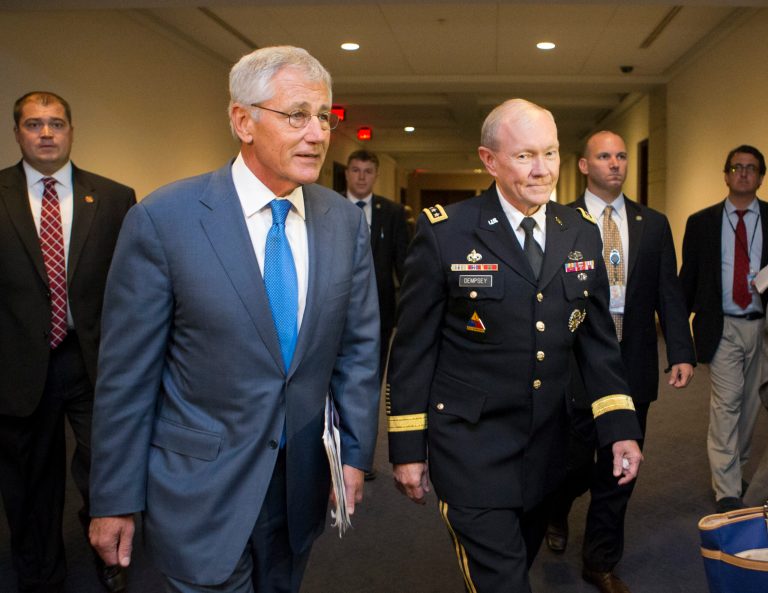 Defense Secretary Chuck Hagel, left, and Joint Chiefs Chairman Gen. Martin Dempsey, right, arrive for a closed-door intelligence briefing with members of the House of Representatives on the situation in Syria, at the Capitol, in Washington, Monday, Sept. 9, 2013. It is the first full day of legislative business for Congress as lawmakers return from the August recess and President Barack Obama is seeking congressional approval for a military strike against Syria for its use of chemical weapons in the civil war. (AP Photo/J. Scott Applewhite)