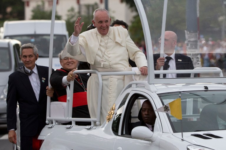 Pope Francis waves to people from his popemobile as he arrives to the Apostolic Nunciature in Havana, Cuba, Saturday, Sept. 19, 2015. (AP Photo/Alessandra Tarantino)