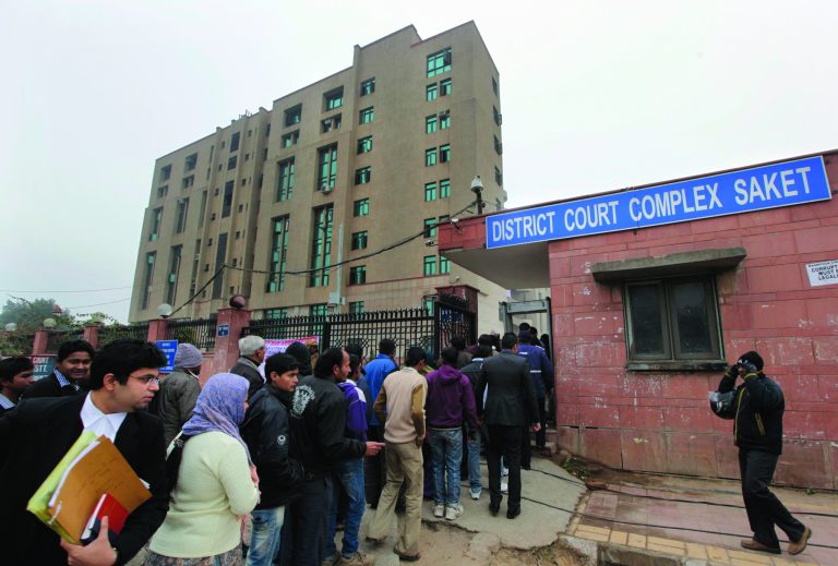 Indians stand in a queue to enter the District Court complex where a new fast-track court was inaugurated Wednesday to deal specifically with crimes against women, in New Delhi, India, Thursday, Jan. 3, 2013. Indian police were preparing Thursday to file rape and murder charges against a group of men accused of sexually assaulting a 23-year-old university student for hours on a moving bus in New Delhi. The Dec. 16 attack on the woman, who later died of her injuries, has caused outrage across India, sparking protests and demands for tough new rape laws, better police protection for women and a sustained campaign to change society's views about women. (AP Photo/ Manish Swarup)