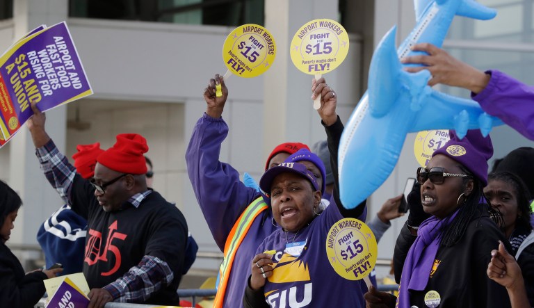 SEIU union members protest for an increase in the minimum wage. SEIU fired one of the lead architects of its $15 minimum wage campaign, stating that he violated the union's ethics rules regarding nepotism. (AP Photo/Carlos Osorio)