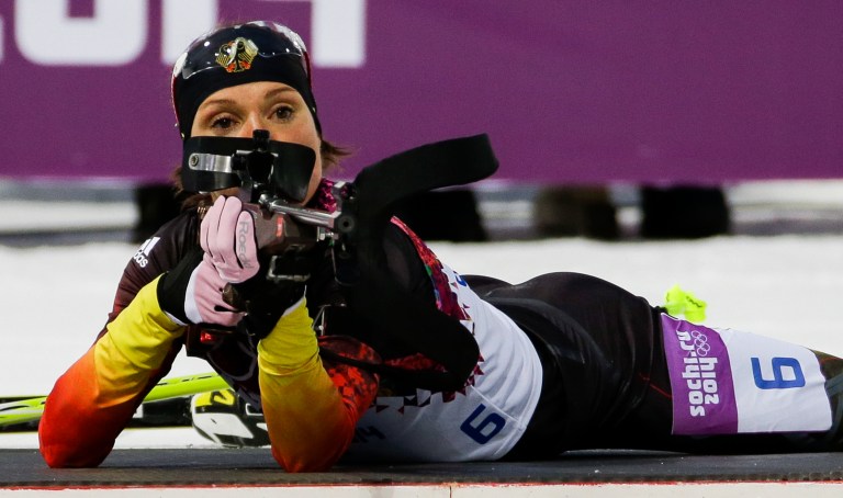 FILE - In this Feb. 9, 2014 file photo, Germany's Evi Sachenbacher-Stehle prepares to shoot during the women's biathlon 7.5k sprint, at the 2014 Winter Olympics, in Krasnaya Polyana, Russia. German Olympic officials said Sachenbacher-Stehle has been kicked out of the Sochi Games after a positive doping test. The German Olympic Committee said she tested positive on Monday, Feb. Feb. 17, for the stimulant methylhexanamine. Both the 