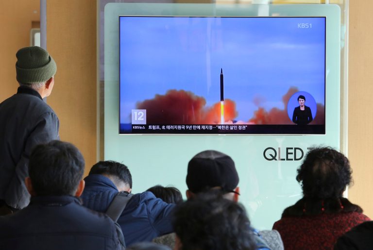 People watch a TV screen showing file footage of North Korea's missile launch at Seoul Railway Station in Seoul, South Korea, on Nov. 21, 2017. (AP Photo/Ahn Young-joon)