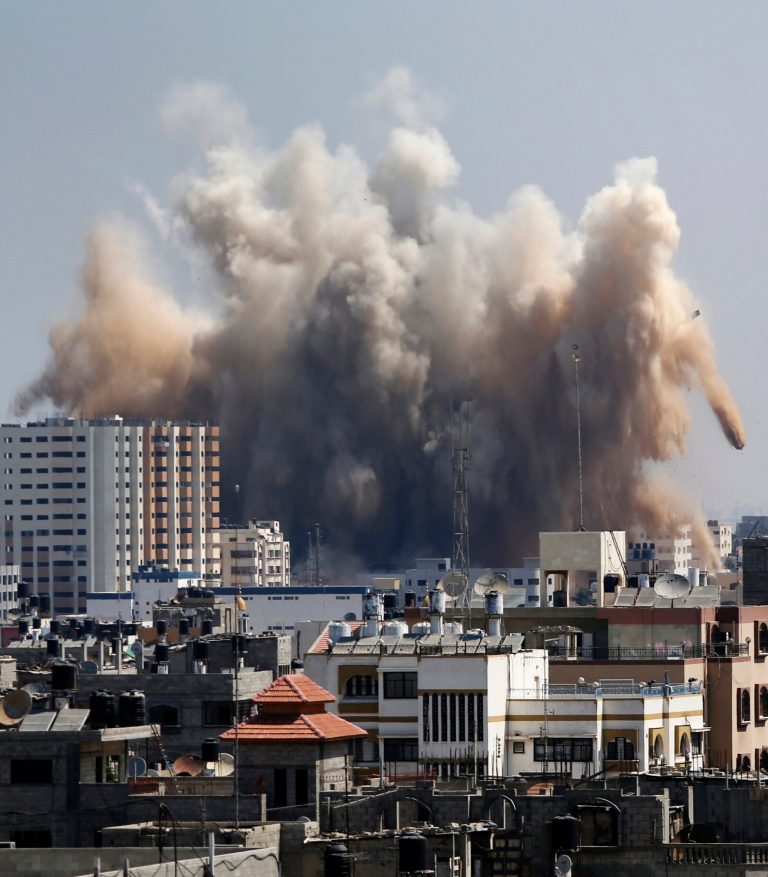 Smoke, dust and debris rise over Gaza City after an Israeli strike, Friday, Aug. 8, 2014, as Israel and Gaza militants resumed cross-border attacks after a three-day truce expired and Egyptian-brokered talks on a new border deal for blockaded Gaza hit a deadlock. (AP Photo/Hatem Moussa)