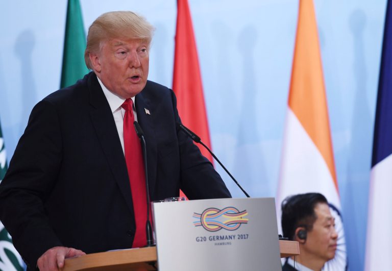 President Trump's statement that he didn't know of his son's June 2016 meeting until a few days ago aligns with Donald Trump Jr's account. (Patrik Stollarz/Pool Photo via AP)