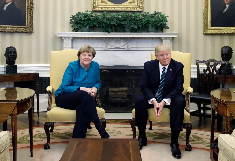 President Trump gave German Chancellor Angela Merkel a fake IOU for money her country owes the United States for NATO, according to a published report. (AP Photo/Evan Vucci)