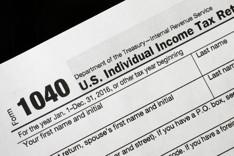 About 6.5 million taxpayers paid the penalty for not having insurance in 2015, down from 2014. (AP Photo/Mark Lennihan)