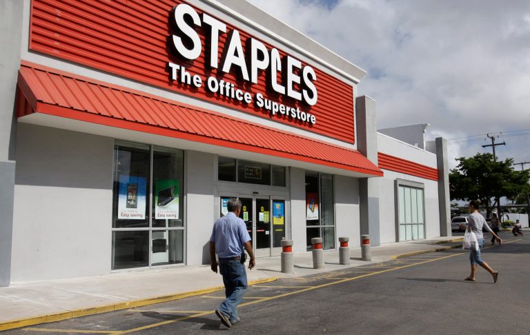 FILE - In this Tuesday, Nov. 15, 2011, file photo, customers enter Staples office supply store in Miami. Staples on Tuesday, Oct. 21, 2014 said it is looking into a potential credit card data breach and has been in touch with law enforcement officials about the issue. (AP Photo/ Lynne Sladky, File)