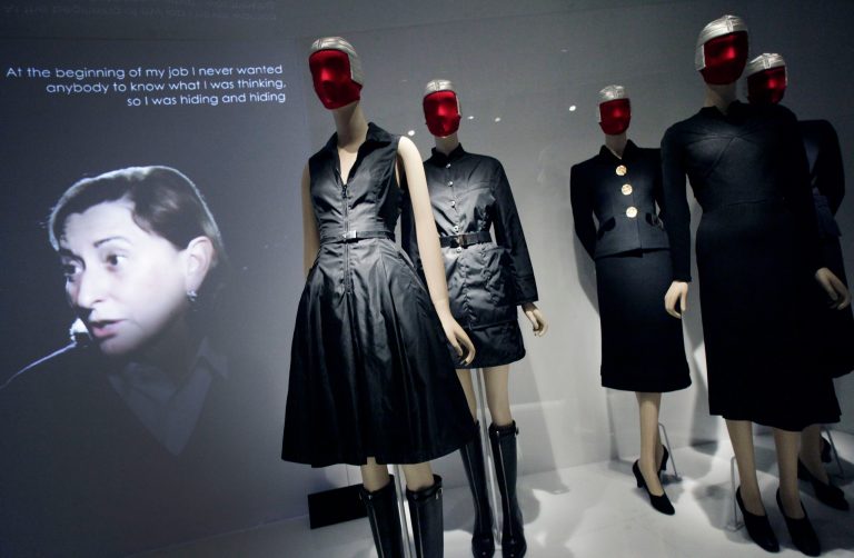   FILE - This May 7, 2012 file photo shows Miuccia Prada, left, speaking in a video about her two fashions, center, and those of Elsa Schiaparelli, right, at an exhibit at the Metropolitan Museum of Art in New York. The show 