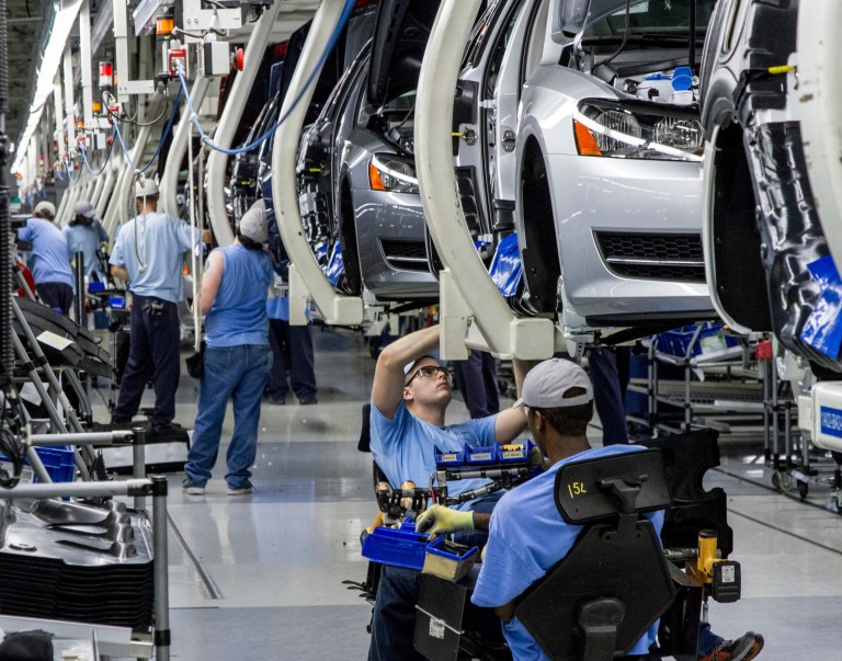 In this June 12, 2013, file photo, workers assemble Volkswagen Passat sedans at the German automaker's plant in Chattanooga, Tenn. (AP Photo/Erik Schelzig, file)