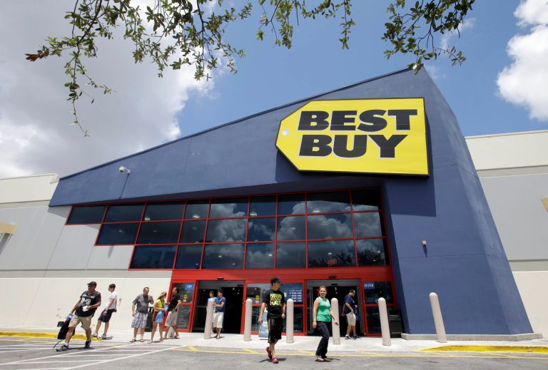 FILE - In this Monday, Aug. 19, 2013 file photo, shoppers walk toward the parking lot at a Best Buy store in Hialeah, Fla. (AP Photo/Alan Diaz, File)
