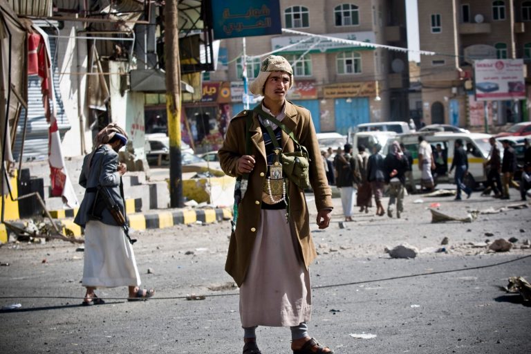 A Houthi Shiite Yemeni stands guard at a street leading to the presidential palace in Sanaa, Yemen, Wednesday, Jan. 21, 2015. (AP Photo)