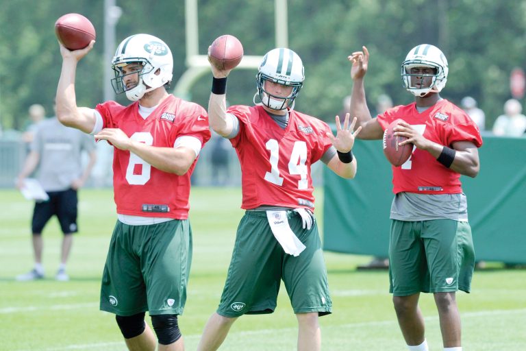 Bill Kostroun/AP
Quarterbacks, from left, Mark Sanchez, Greg McElroy and Geno Smith practice at Jets minicamp Tuesday in Florham Park, N.J.