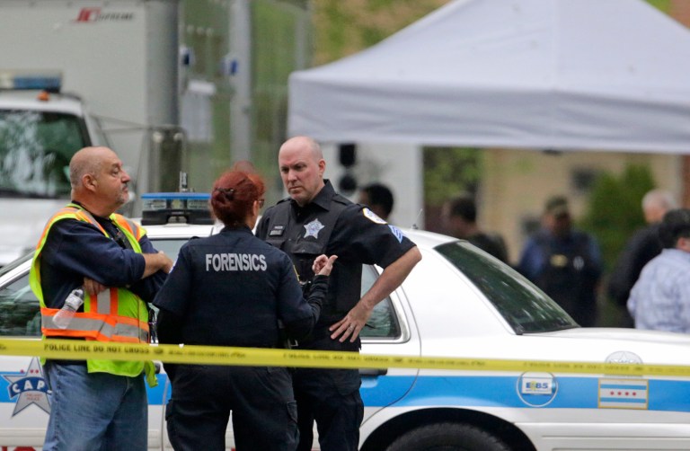 As of Monday morning, four people had been killed and dozens more wounded during a bloody, violent weekend in Chicago. (AP Photo/M. Spencer Green)