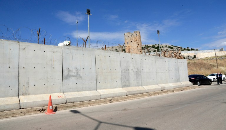 This May 24, 2017 file photo shows the newly built wall near Cilvegozu border gate in Reyhanli, at the Turkey-Syria border. (AP Photo/Burhan Ozbilici, File)