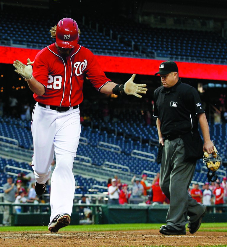 Alex Brandon/AP
Jayson Werth led off the ninth with a home run that tied the game after a two-hour, 33-minute rain delay.