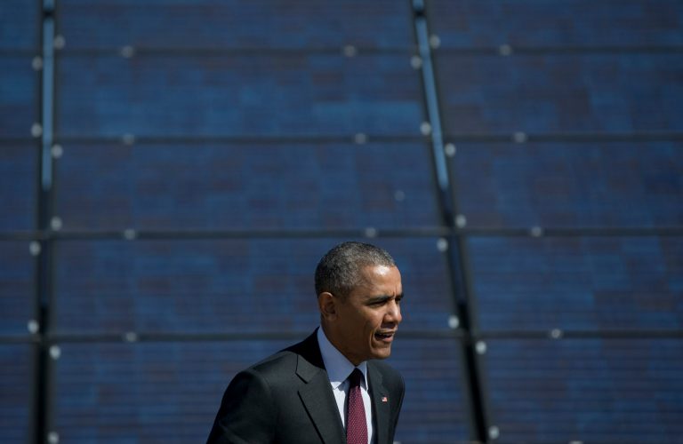 President Obama walks past a panel of a solar array at Hill Air Force Base, Friday, April 3, 2015, in Hill Air Force Base, Utah, to speak about clean energy and jobs numbers. (AP Photo/Carolyn Kaster)