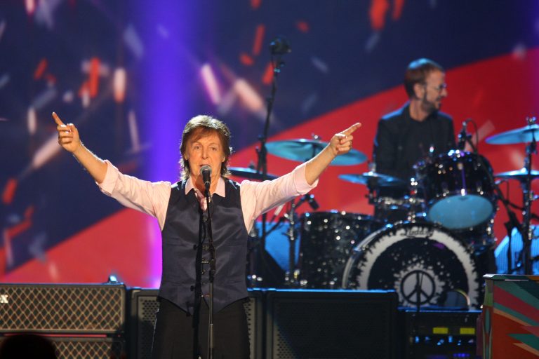 FILE - In this Jan. 27, 2014 file photo, Paul McCartney and Ringo Starr perform at The Night that Changed America: A Grammy Salute to the Beatles,  in Los Angeles. McCartney has canceled his concert in South Korea next week due to the virus-caused illness that forced him to call off his entire Japan tour, organizers said Wednesday, May 21, 2014. The former Beatle, who turns 72 next month, had planned to hold concerts in Japan and South Korea as part of his world tour. (Photo by Zach Cordner/Invision/AP, File)