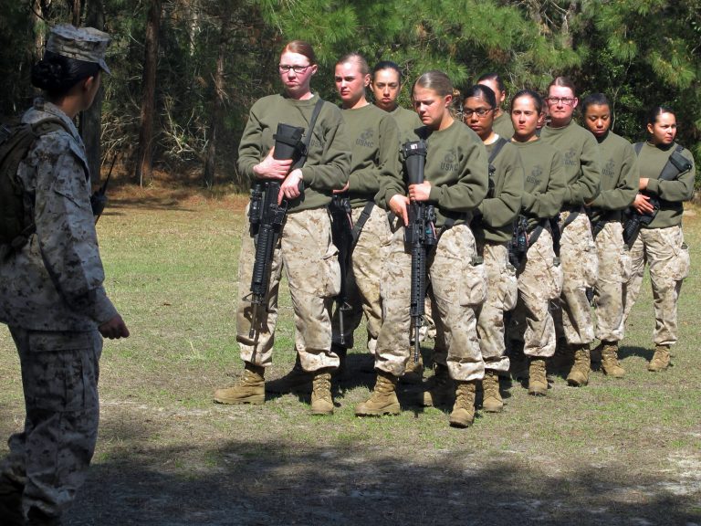 Marine Corps ordered to make some of its job titles gender neutral by April following last year's historic move to open all combat positions to women. (AP Photo/Bruce Smith)