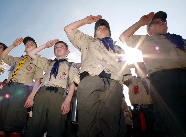 Boy Scouts salute early Saturday morning, May 21, 2011 during New Jersey's Boy Scouts Camporee in Sea Girt, N.J. The Boy Scouts of America's National Council has voted to ease a long-standing ban and allow openly gay boys to be accepted as Scouts, Thursday, May 23, 2013. Of the local Scout leaders voting at their annual meeting in Texas, more than 60 percent supported the proposal. (AP Photo/Mel Evans, file)