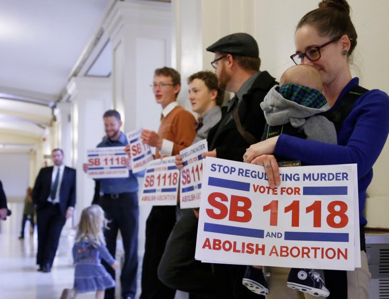 Indiana on Thursday became the second state to ban abortions chosen solely because of the unborn child's disability, race or sex. (AP Photo/Sue Ogrocki)