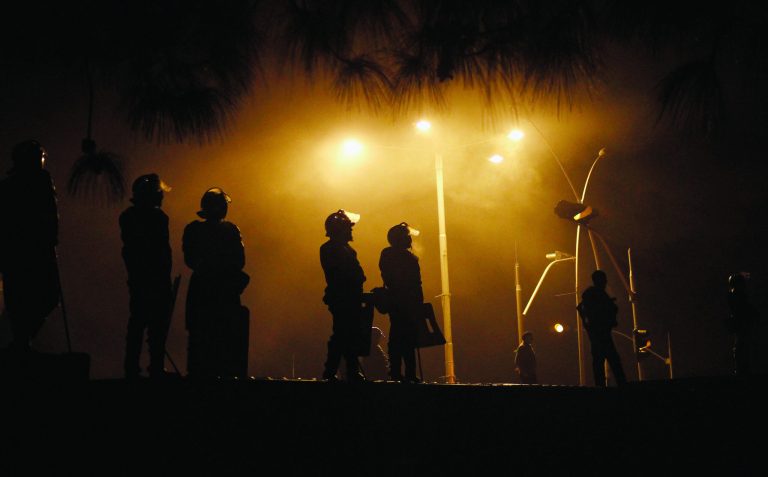 Pakistani police officers stand guards on a shipping container placed to block the supporters of Pakistani Sunni Muslim cleric Tahir-ul-Qadri, to enter into high security area Red Zone during an anti government rally in Islamabad, Pakistan Tuesday, Jan. 15, 2013. Thousands of Pakistanis fed up with political leaders they say are corrupt and indifferent rallied in the Pakistani capital Tuesday, as the fiery cleric who organized the rally called for the government to resign and for his followers to remain on the streets until then. (AP Photo/Anjum Naveed)