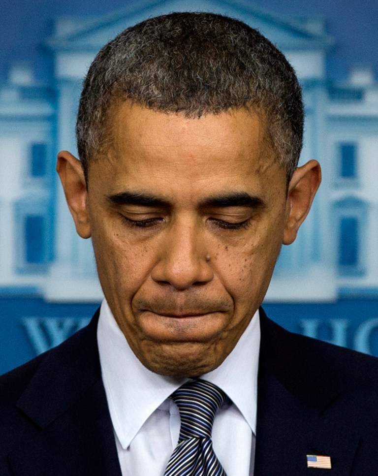   President Barack Obama pauses as he talks about the Connecticut elementary school shooting, Friday, Dec. 14, 2012, in the White House briefing room in Washington. (AP Photo/Carolyn Kaster)  