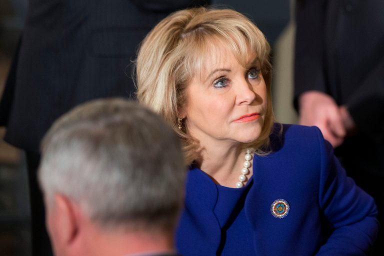 National Governors Association (NGA) Chair Oklahoma Gov. Mary Fallin waits for the arrival of President Barack Obama to speak to members of the National Governors Association in the State Dining Room of the White House in Washington, Monday, Feb. 24, 2014. (AP Photo/Jacquelyn Martin)