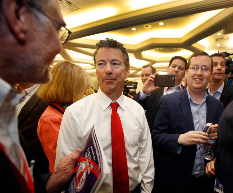 Republican presidential hopeful Sen. Rand Paul, R-Ky. talks with voters after speaking at the Republican Leadership Summit Saturday, April 18, 2015, in Nashua, N.H. (AP Photo/Jim Cole)