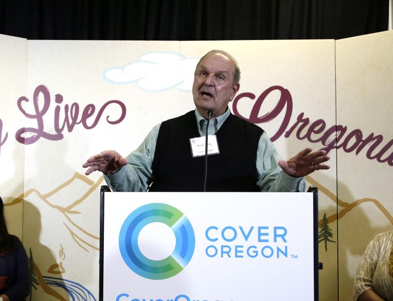 FILE - In this Oct. 1, 2013 file photo, Cover Oregon executive director Rocky King speaks during the rollout of Oregon's health insurance exchange in Portland, Ore. With all the problems facing the rollout of President Barack Obama's health care overhaul, nowhere is the situation worse or more surprising than in Oregon, a progressive state that has enthusiastically embraced the federal law but has so far failed to enroll a single person in coverage through Cover Oregon. (AP Photo/Don Ryan, File)