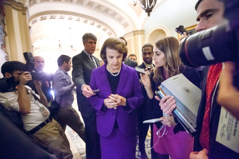 Senate Intelligence Committee Chair Sen. Dianne Feinstein, D-Calif. is surrounded by reporters on Capitol Hill in Washington. (AP Photo/J. Scott Applewhite)