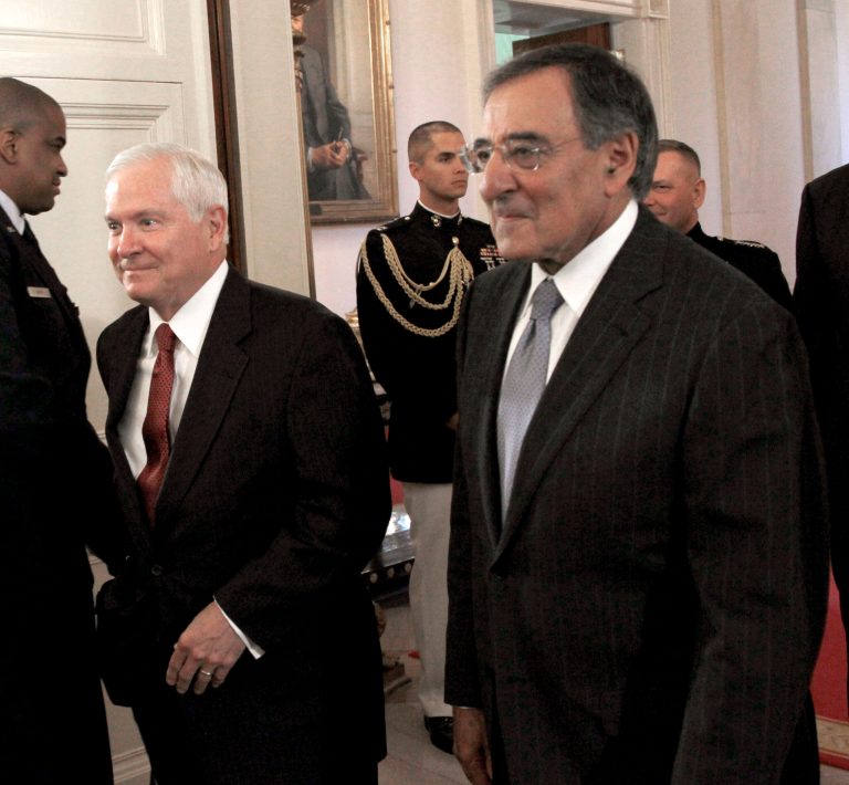 Former Defense secretaries Robert Gates, left, and CIA Director Leon Panetta, right, walk into the East Room of the White House on Sept. 21. Both criticized his handling of the Syria crisis in speeches on Tuesday. (AP Photo/Pablo Martinez Monsivais)