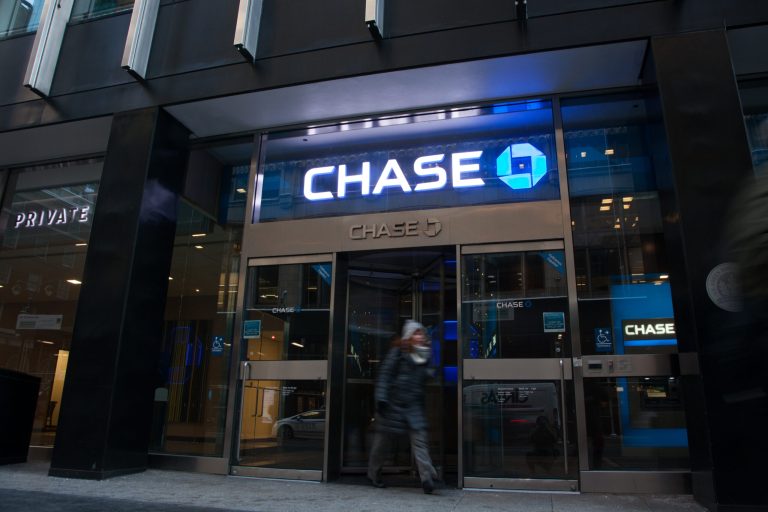 A customer exits a JPMorgan Chase & Co. branch in New York in early 2018. The largest U.S. lender plans to invest $20 billion over the next five years in opening new branches around the country as well as increasing mortgage and small-business loans. (Daniel Tepper/Bloomberg)