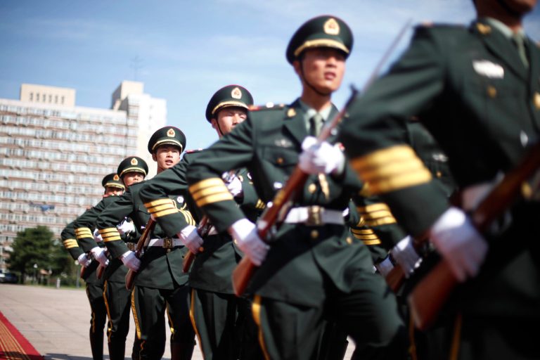 Chinese soldiers march after the inspection of the honor guard during a welcome ceremony at PLA Headquarters in Beijing, China, Thursday, Aug. 20, 2009. (AP Photo/Elizabeth Dalziel, Pool)