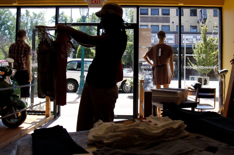   FILE - In this Aug. 26, 2010, file photo, Kim Miller shops for clothes in St. Louis. On Friday, Aug. 30, 2013, the Commerce Department said that consumer spending rose just 0.1 percent in July from the previous month. Thatâs slower than Juneâs 0.6 percent increase. (AP Photo/Jeff Roberson, File)  