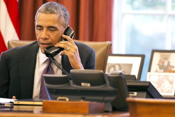 President Barack Obama speaks during a phone call about Wednesday, Oct. 8, 2014, in the Oval Office of the White House Washington. (AP Photo/Jacquelyn Martin)