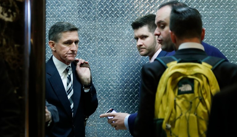 In this Nov. 17, 2016, file photo, retired Lt. Gen Mike Flynn, left, his son Michael G. Flynn, second from left, and Boris Epshteyn, a spokesman for President-elect Donald Trump, third from left, board an elevator at Trump Tower in New York. (AP Photo/Carolyn Kaster, File)