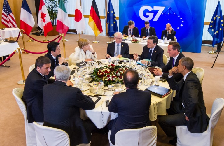 Group of 7 leaders from right clockwise, U.S. President Barack Obama, French President Francois Hollande, Canadian Prime Minister Stephen Harper, Italian Prime Minister Matteo Renzi, Japanese Prime Minister Shinzo Abe, German Chancellor Angela Merkel, European Council President Herman Van Rompuy, European Commission President Jose Manuel Barroso and British Prime Minister David Cameron a G-7 summit at the EU Council building in Brussels on Thursday, June 5, 2014. (AP Photo)