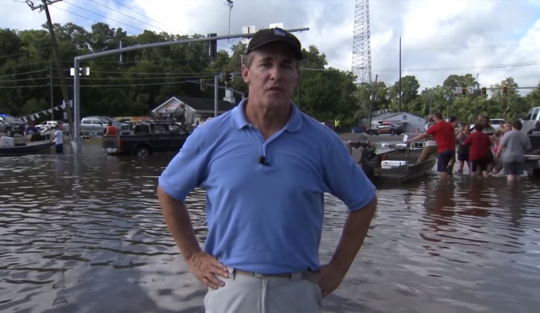 Weather Channel meteorologist and field reporter Mike Seidel nearly got hit by a beach chair. (Image courtesy screenshot)